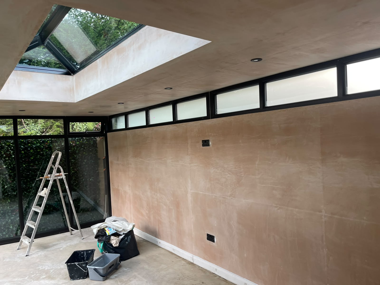 Sunroom plaster wall and ceiling before painting