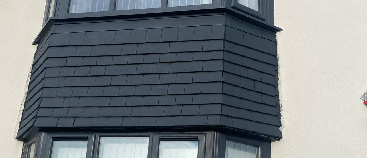 Bay window cladding finished in deep matt black